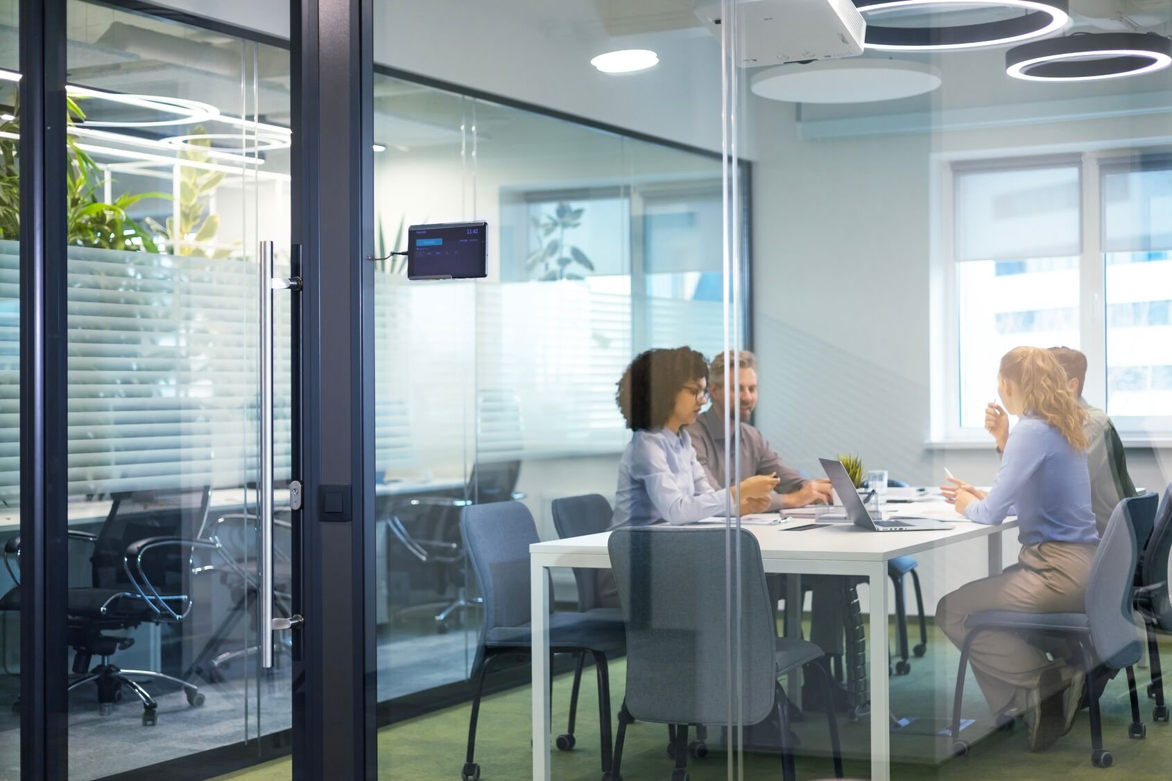 Web_Wide-Business office with blurred people casual wear, with blurred bokeh background